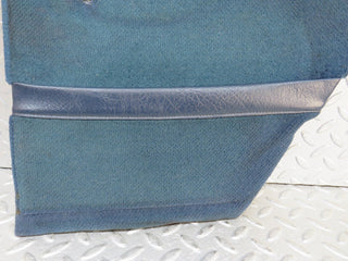 W109 front left kick panel blue used OEM