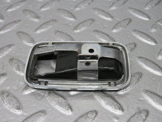 W123 chrome frame for door opener right used OEM