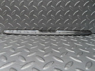 R107 SLC trunk chrome handle moulding used OEM