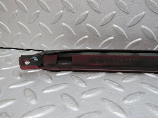 R129 SL left headlight lower trim used OEM