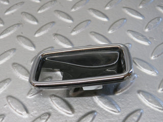 W123 chrome frame for door opener left used OEM