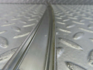 W123 rear left chrome window channel used OEM
