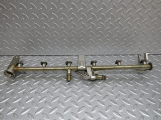 W124 Cabriolet fuel injector rail used OEM