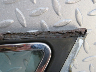 W109 front left quarter window glass used OEM