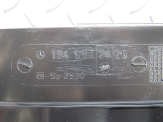 W124 trunk lock trim panel used OEM