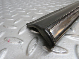 W123 front right door lower moulding trim used OEM