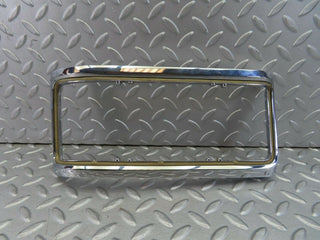 W115 tail light chrome frame left used OEM