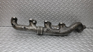 W126 Coupe exhaust manifold left side used OEM