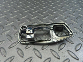 W123 chrome frame for door opener left used OEM