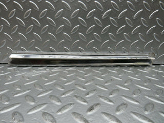 R107 SLC rear left window chrome trim used OEM