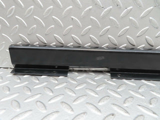 W123 front left cable channel cover used OEM