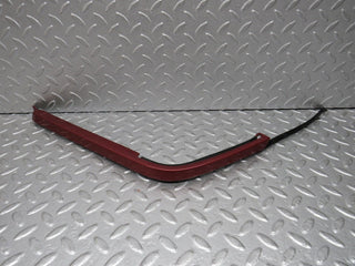 R129 SL left headlight lower trim used OEM
