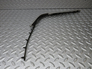 R129 SL left headlight lower trim used OEM