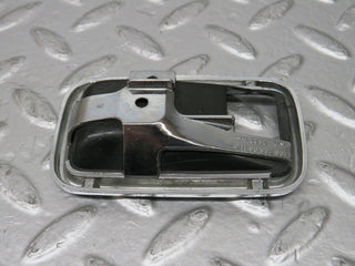 W123 chrome frame for door opener right used OEM
