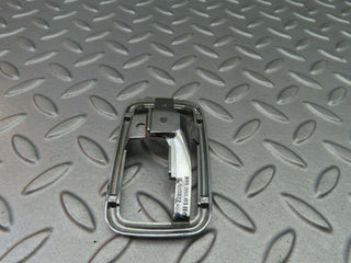 W123 chrome frame for door opener left used OEM