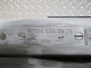 W124 trunk lock trim panel used OEM