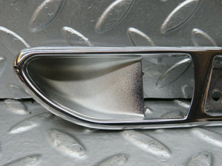 R107 SLC interior door handle chrome surround left side used OEM