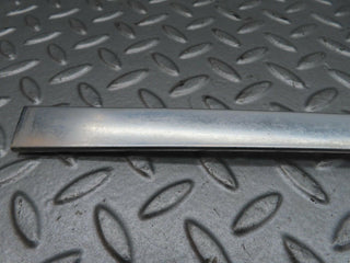 W123 rear left door window chrome frame used OEM