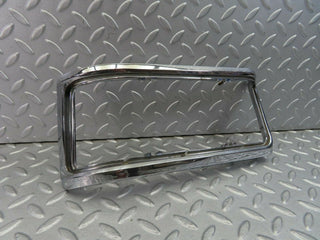 W115 tail light chrome frame left used OEM