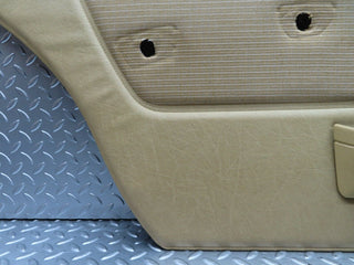 W123 rear left door card beige used OEM