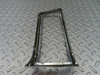W115 tail light chrome frame left used OEM