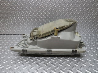 W123 headlight left side used OEM