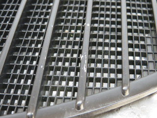 W123 air intake grill left side used OEM