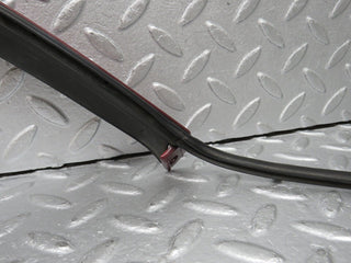 R129 SL left headlight lower trim used OEM