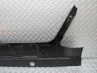 W124 trunk lock trim panel used OEM