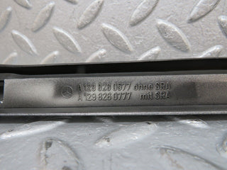 R129 SL left headlight lower trim used OEM