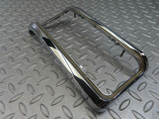 W115 tail light chrome frame left used OEM