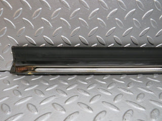 W123 front left door lower moulding trim used OEM