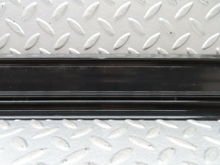 W123 front left door sill trim black used OEM