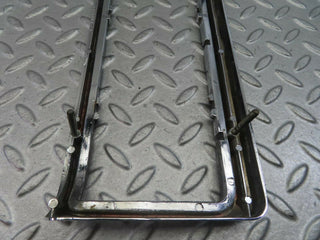 W115 tail light chrome frame left side used OEM