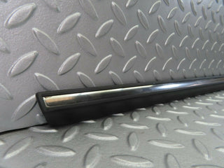 W123 front left door lower trim new OEM