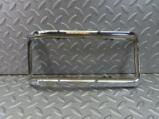 W115 tail light chrome frame left used OEM