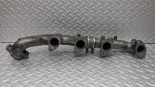 W126 Coupe exhaust manifold left side used OEM