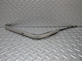 R129 SL left headlight lower trim used OEM