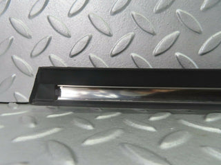 W123 front left door lower trim new OEM