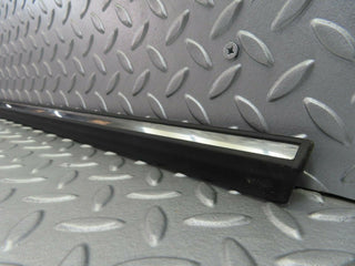 W123 front left door lower trim new OEM