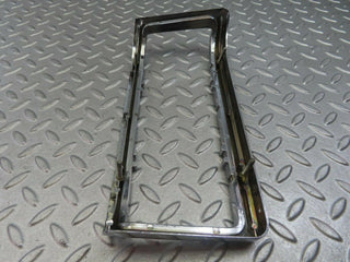 W115 tail light chrome frame left used OEM