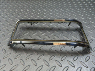 W115 tail light chrome frame left used OEM