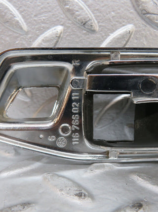 W123 chrome frame door opener rear right used OEM