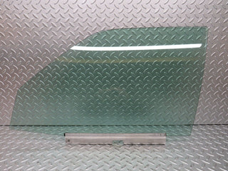 W124 Wagon front left door window glass used OEM