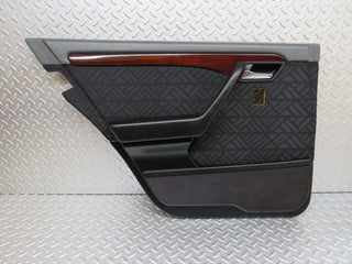 W202 rear left door card used OEM
