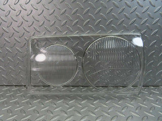 W123 headlight lens left used OEM