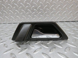 W124 interior door handle left side used OEM