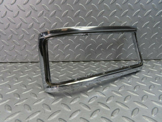 W115 tail light chrome frame left used OEM