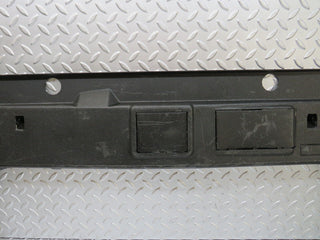 W124 trunk lock trim panel used OEM