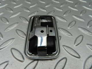 W123 chrome frame for door opener left used OEM